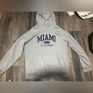 A SHEIN Miami grey hoodie.Good condition,has some faded letter(see in pictures)